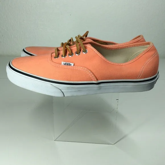 Vans lace up men’s orange salmon colored shoes.