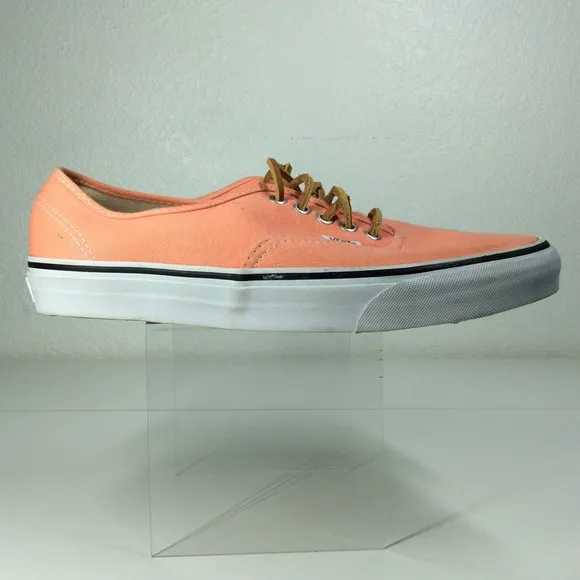 Vans lace up men’s orange salmon colored shoes.