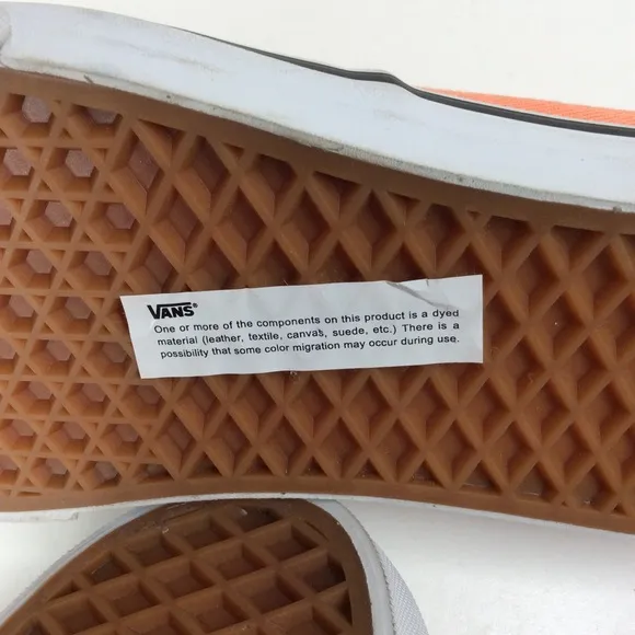 Vans lace up men’s orange salmon colored shoes.